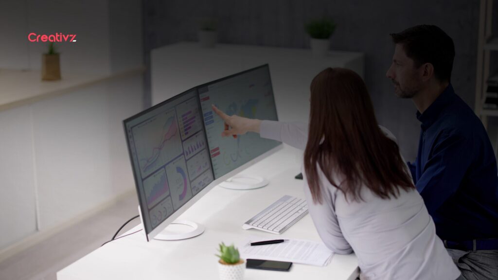 Founder reviewing website analytics with steady traffic but unclear conversions on a laptop screen