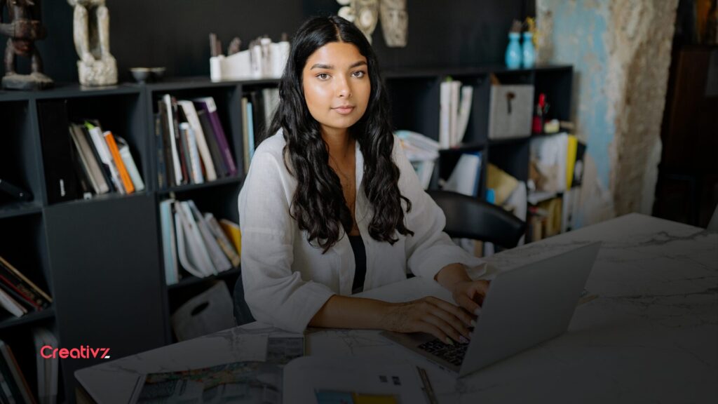 Founder reviewing a structured digital workflow and team systems on a screen, representing scalable operations
