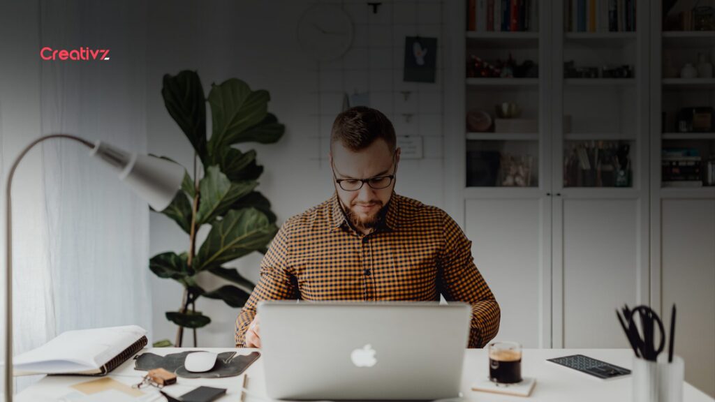 Founder reviewing B2B revenue growth metrics on a screen, representing scalable sales systems
