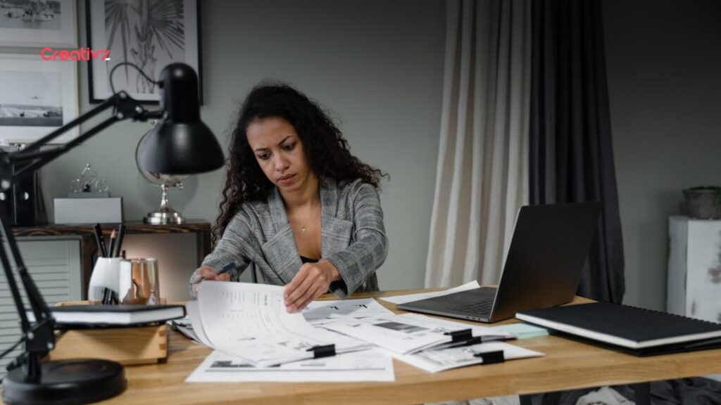 Founder reviewing disconnected business systems and delayed reporting dashboards late at night.