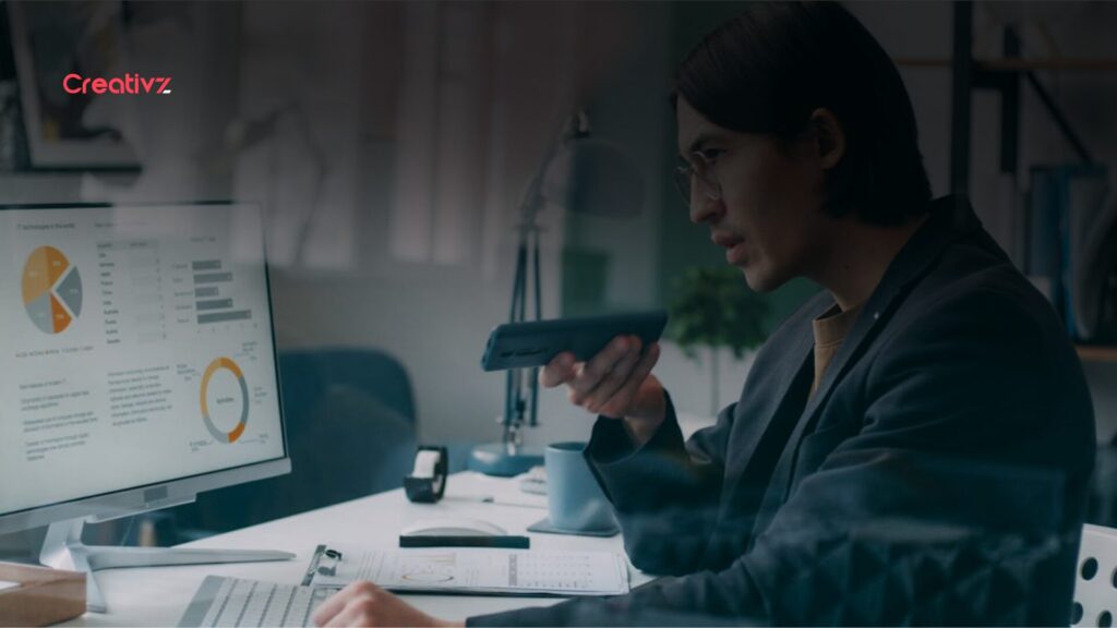 Business owner reviewing CRM dashboard and sales data to track leads and deal progress