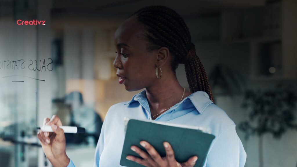 Bank employee reviewing sales performance metrics and customer account targets.