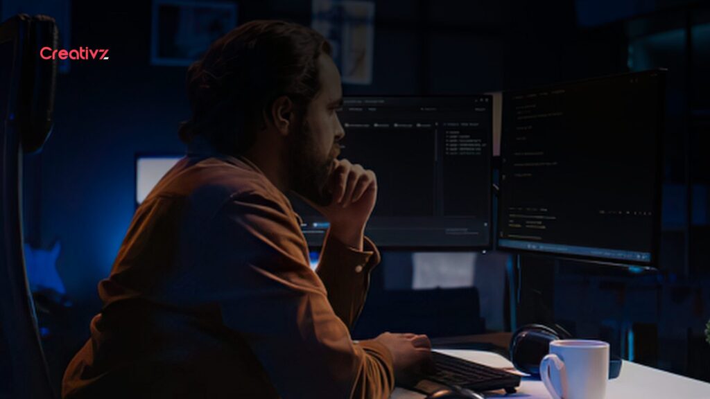 Professional monitoring multiple business systems connected through automation.