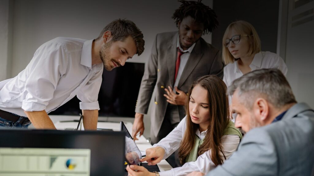 Customer support team reviewing common questions to define the scope of an AI knowledge base.