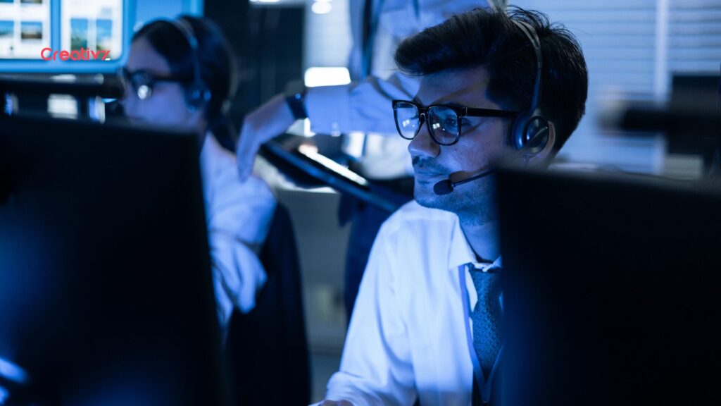 Operations team monitoring automated systems after deployment.