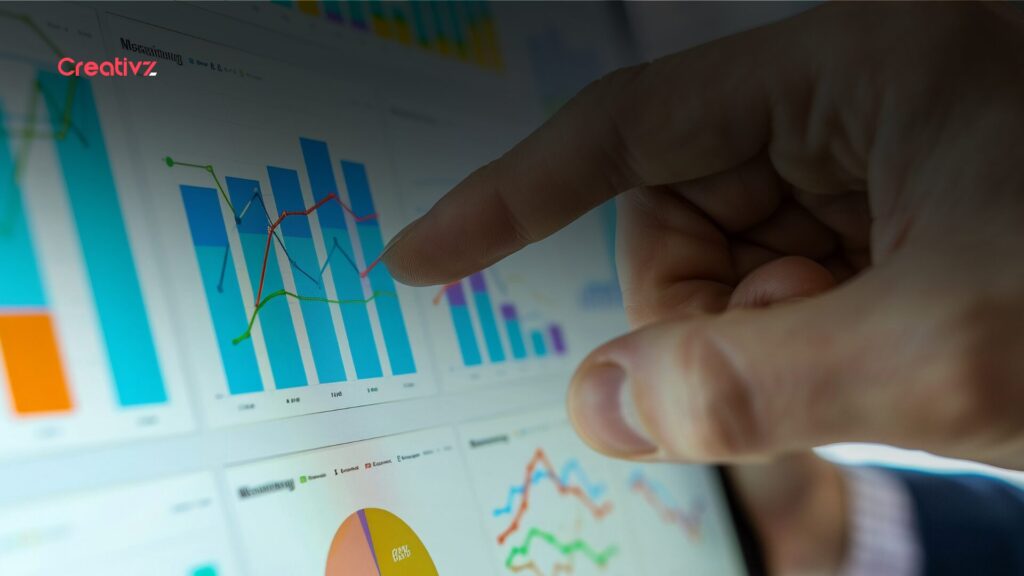 Business professional reviewing performance charts and analytics on a digital dashboard.