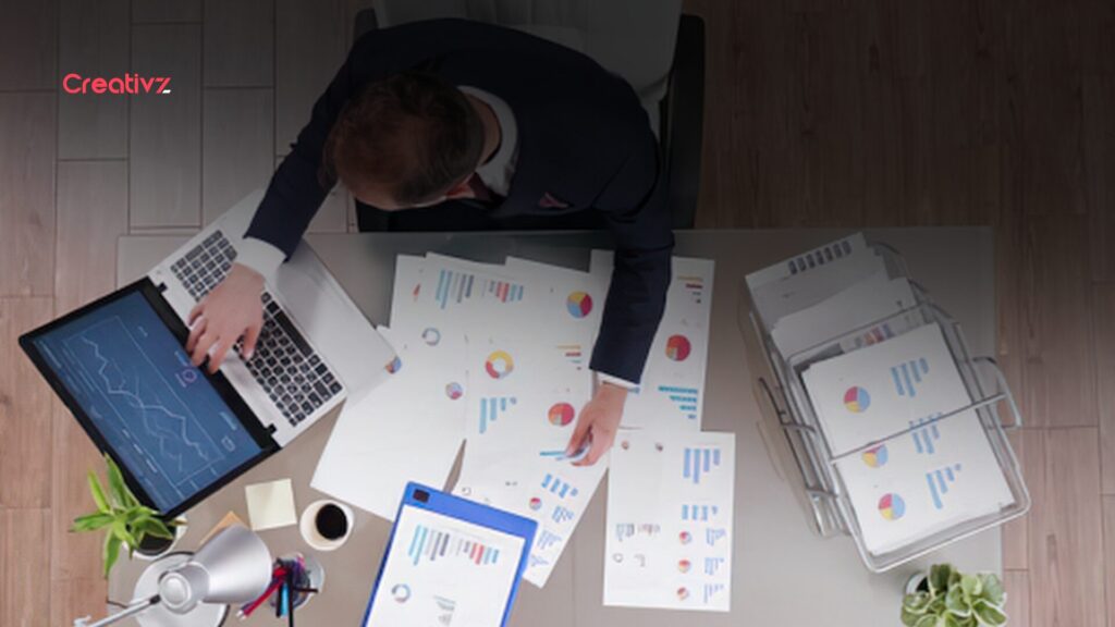 Small business owner reviewing company data before using an AI tool.